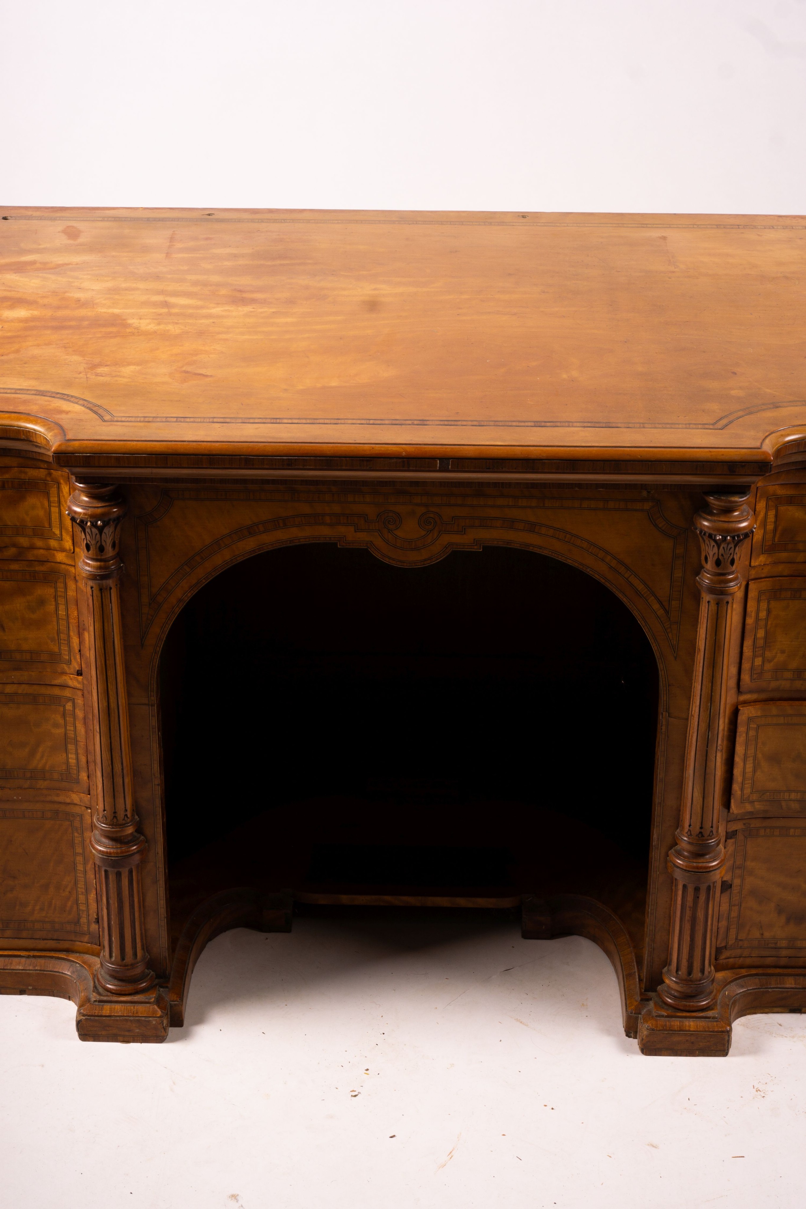 A late Victorian banded satinwood kneehole desk, width 138cm, depth 67cm, height 71cm